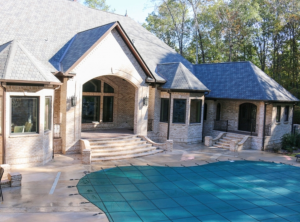 image showing an advanced mesh pool cover that is installed on an inground pool