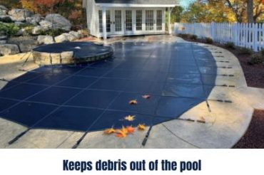 image showing a standard mesh pool cover with leaves and debris on top of it that can't get into the pool