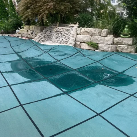 picture of old pool cover with damage that leads to bad seams you can't see