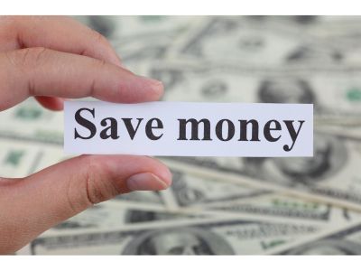 image showing a person holding sign saying "save money" with dollars behind it since customers save money when they measure their own pools